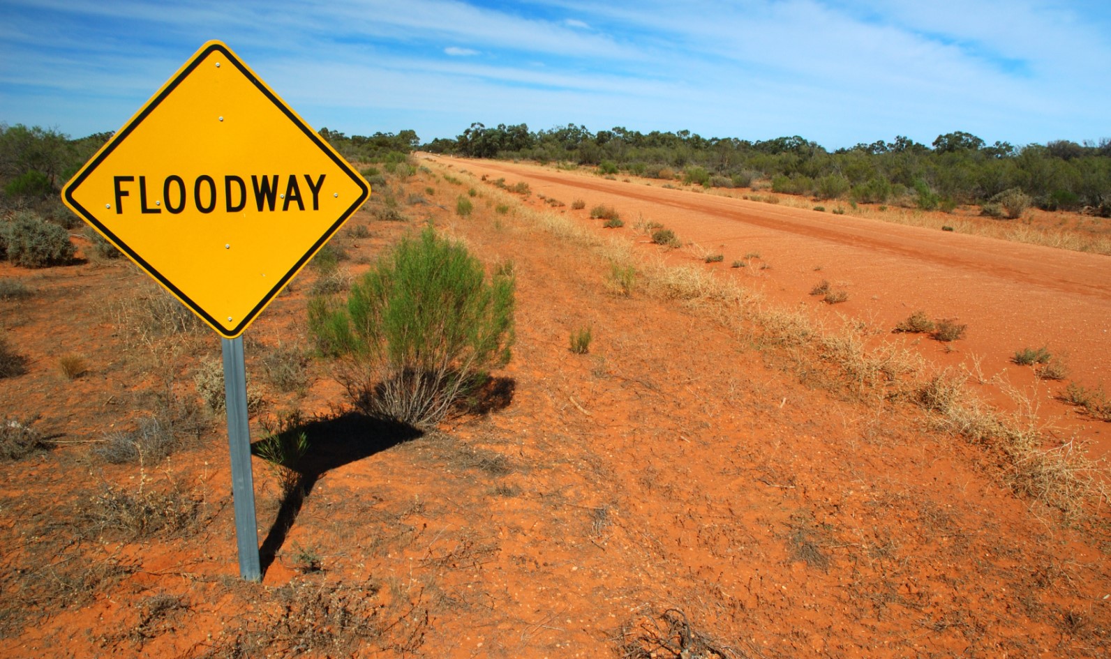 Floodway sign on dirt road