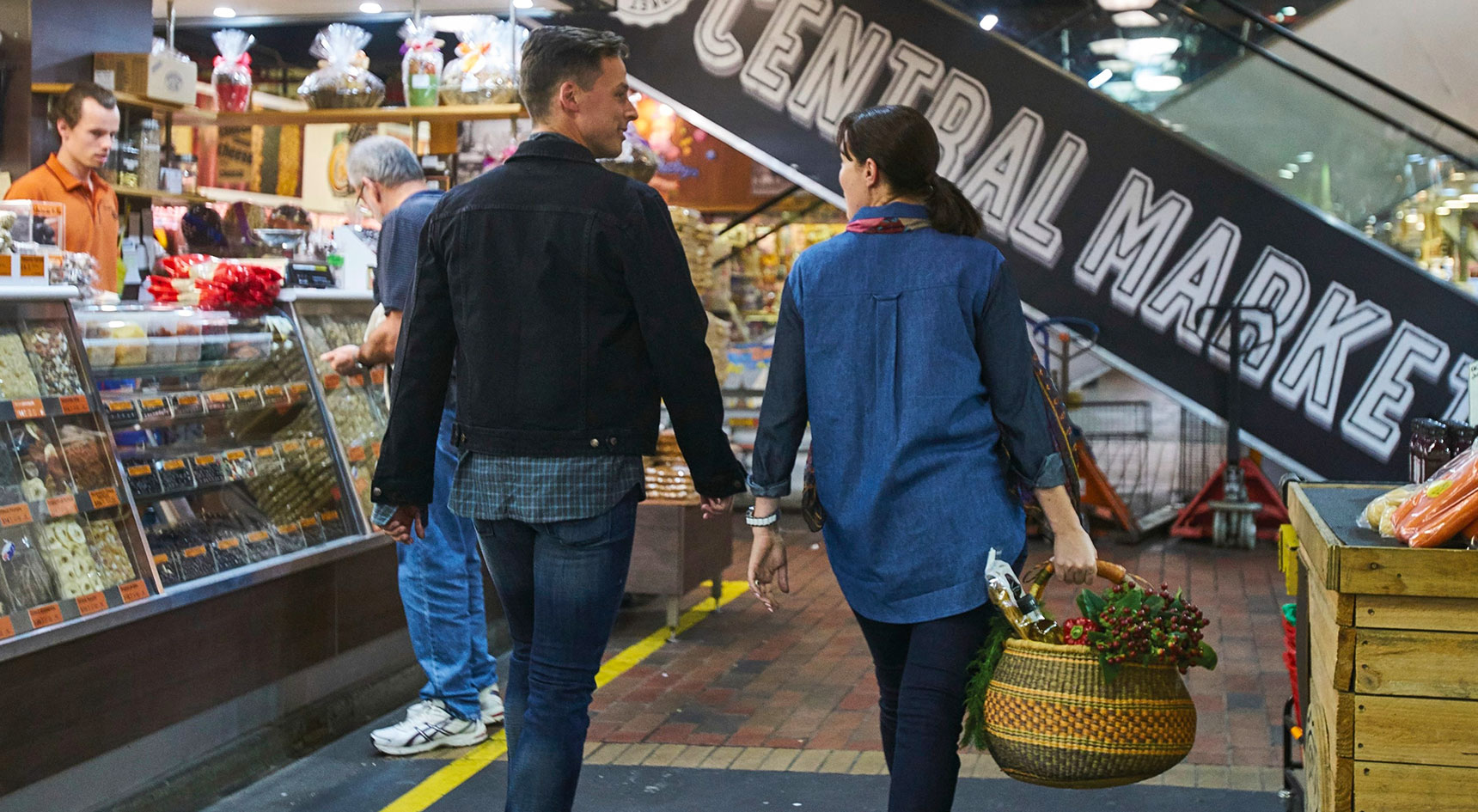 Couple walking through Adelaide Central Markets