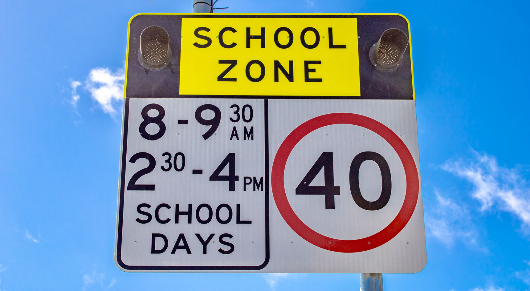 Sign: School zone. 8-9:30am, 2:30-4pm school days: 40