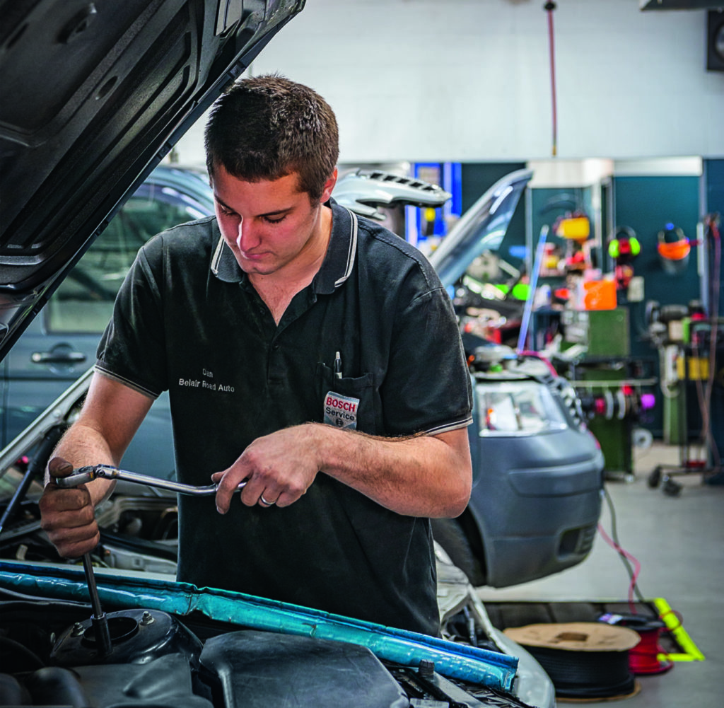 Belair Road Auto repairer works on car 