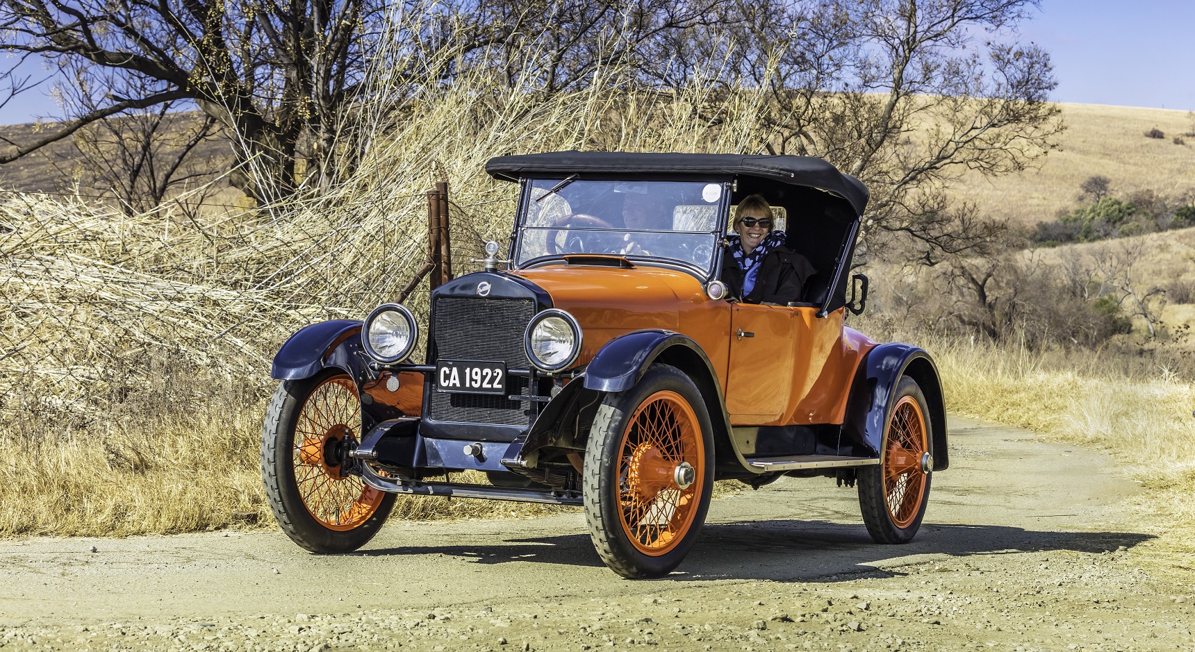 A 1914 Studebaker on a dirt track.