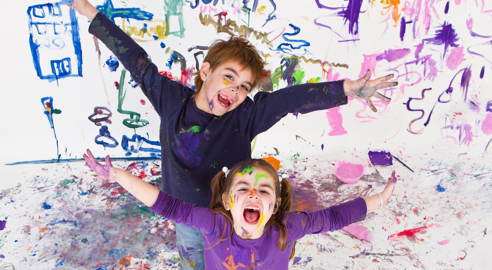 Children happy and painting.