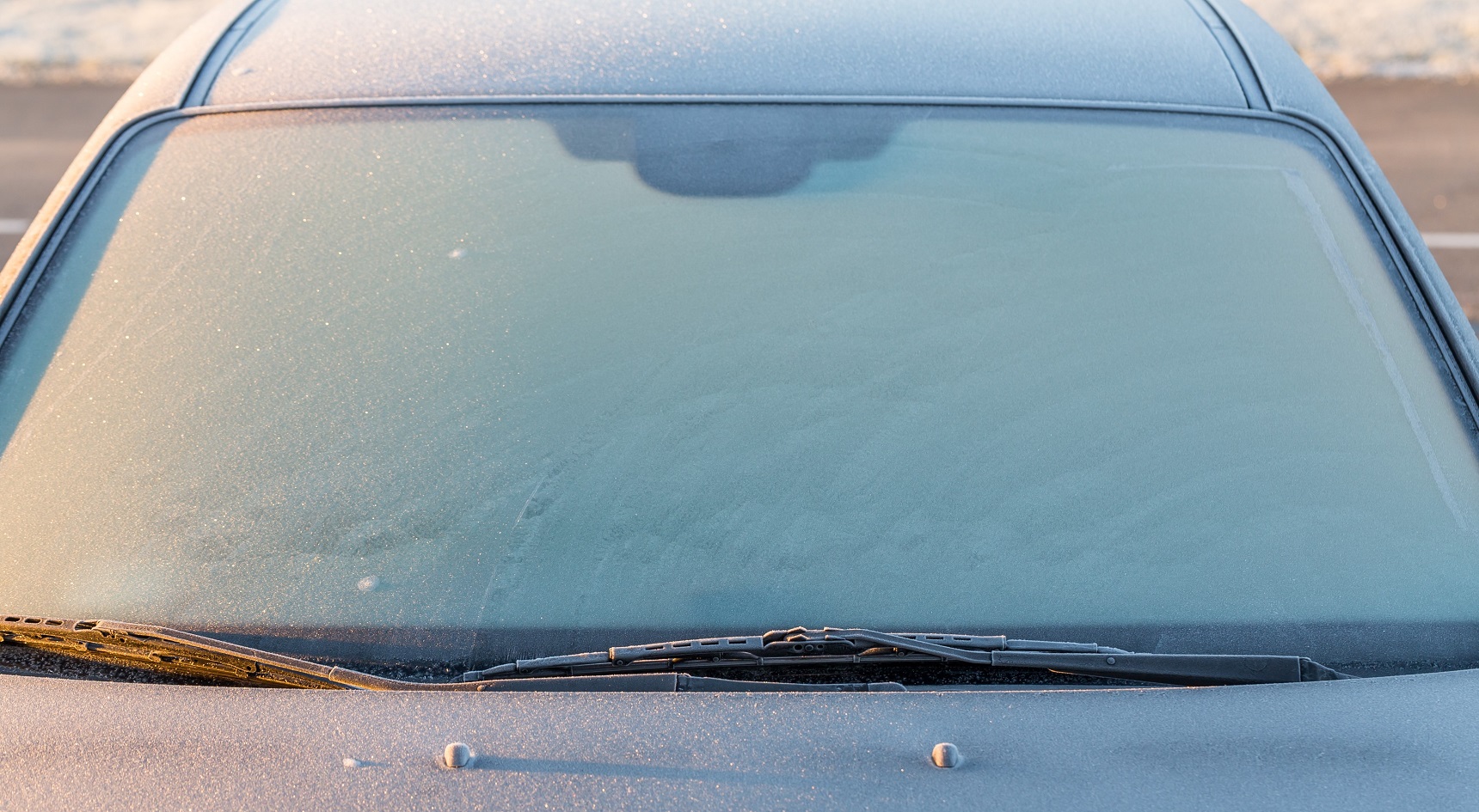A windscreen frosted over.
