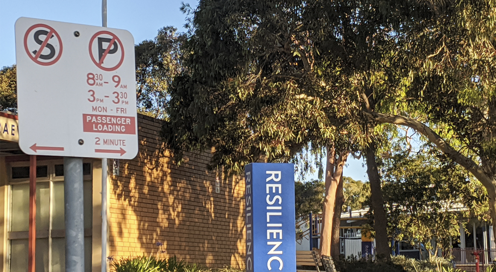 No parking sign in front of a school.