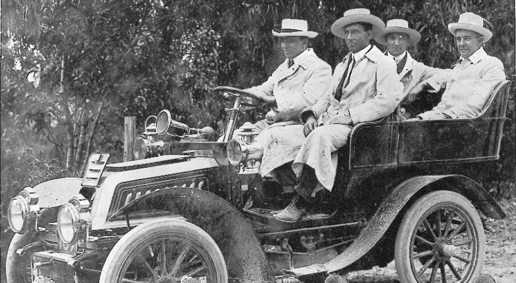 Historic image of RAA members in a car ready for a Hill Climb.