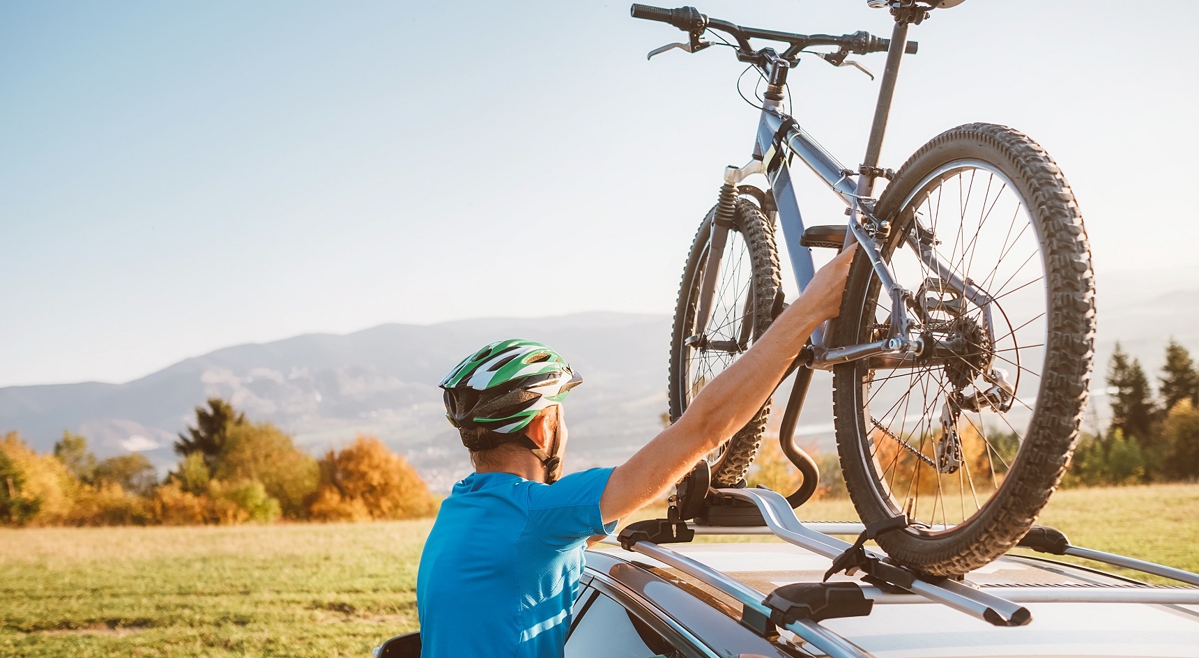 If your car has roof racks, a roof mounted bike rack is a good option. Image: Getty