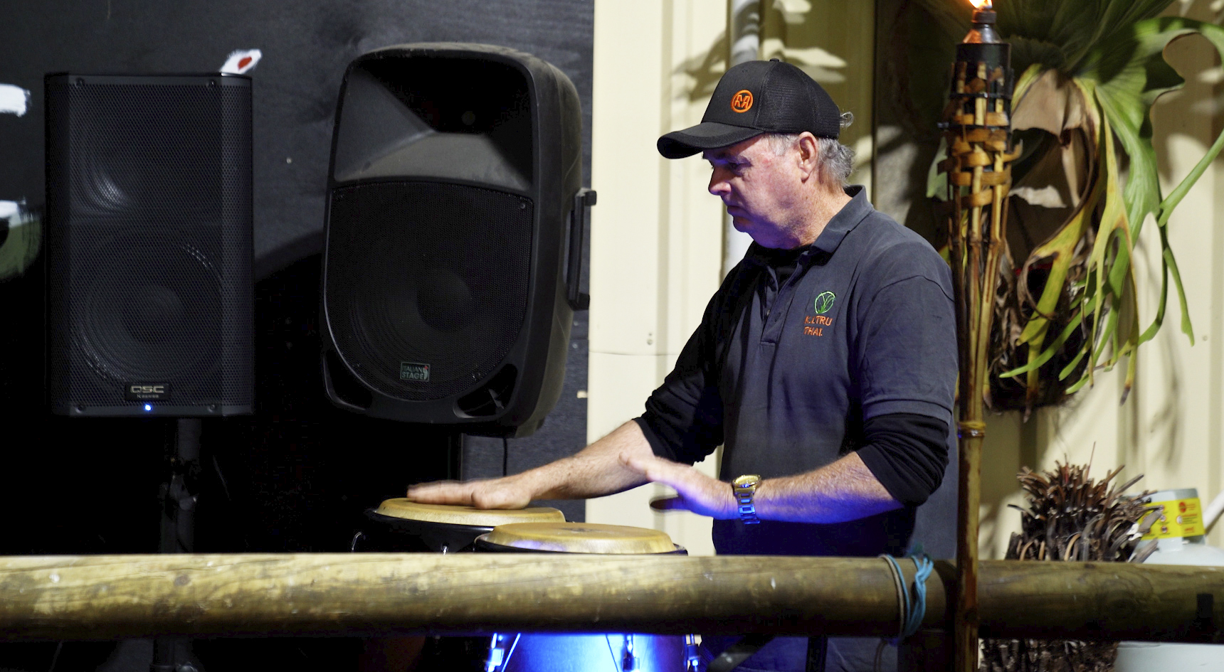 KI Tru Thai owner John Blight playing the bongos at his restaurant.