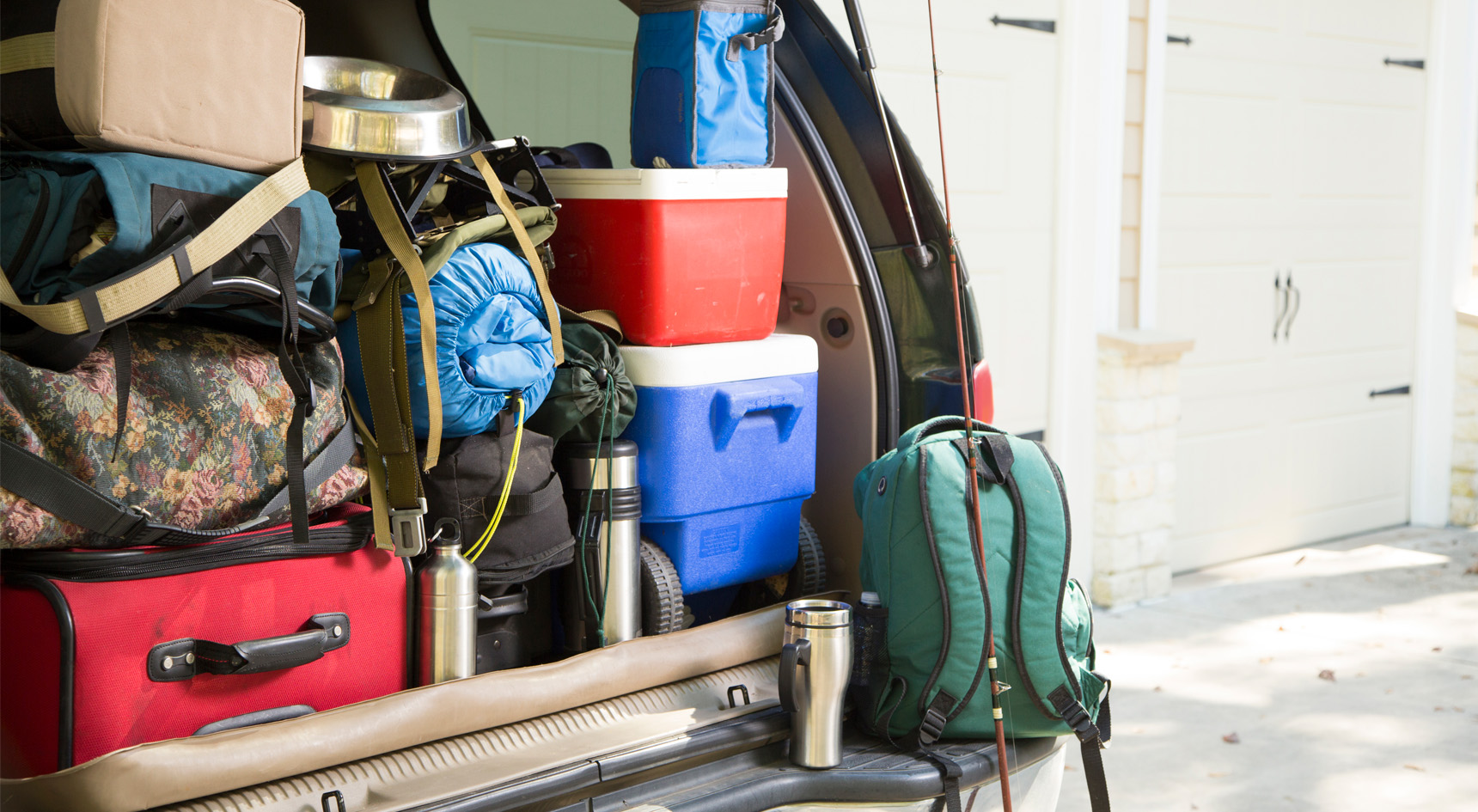 Items stacked in a car boot.