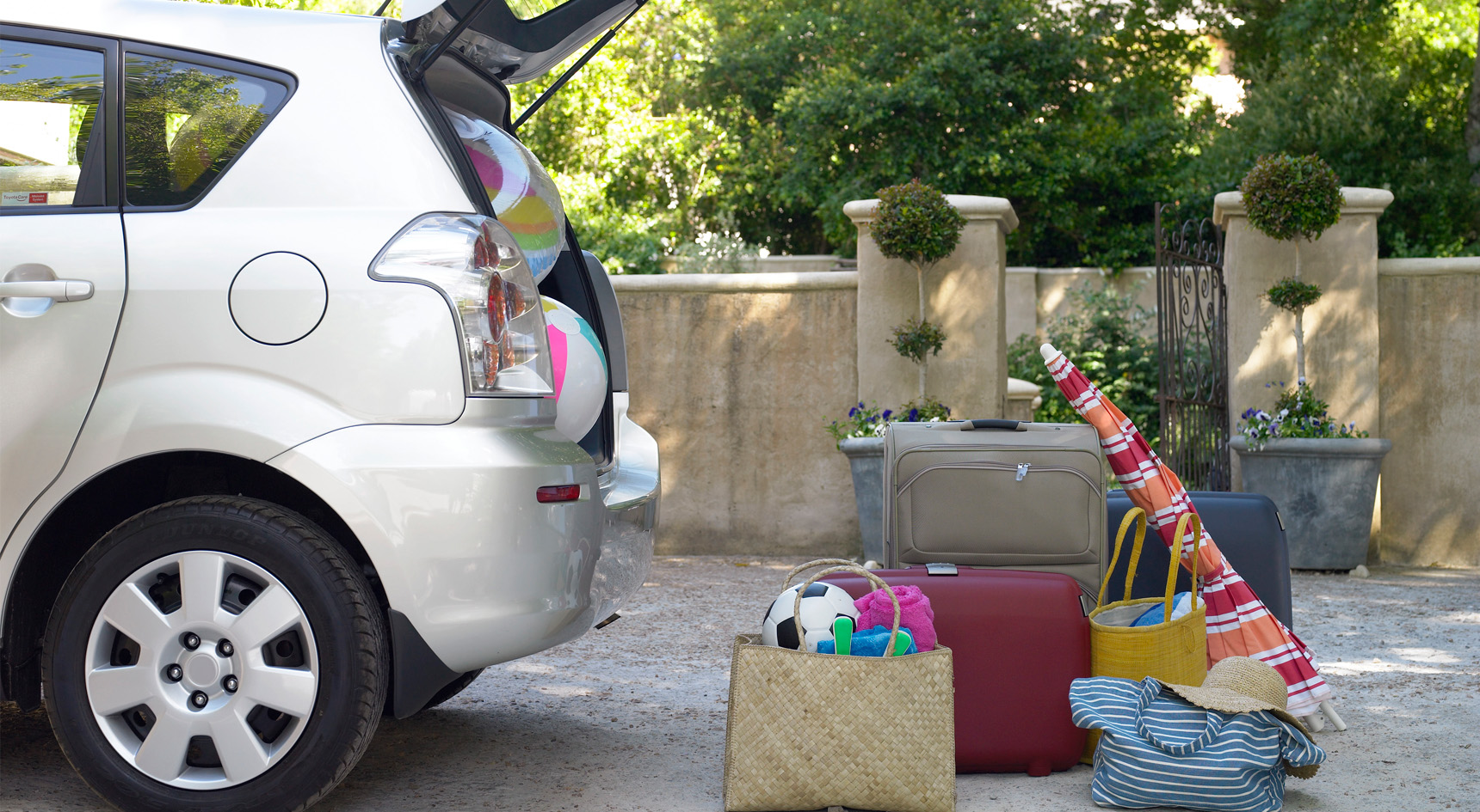 Luggage on the ground ready to be packed in the car.