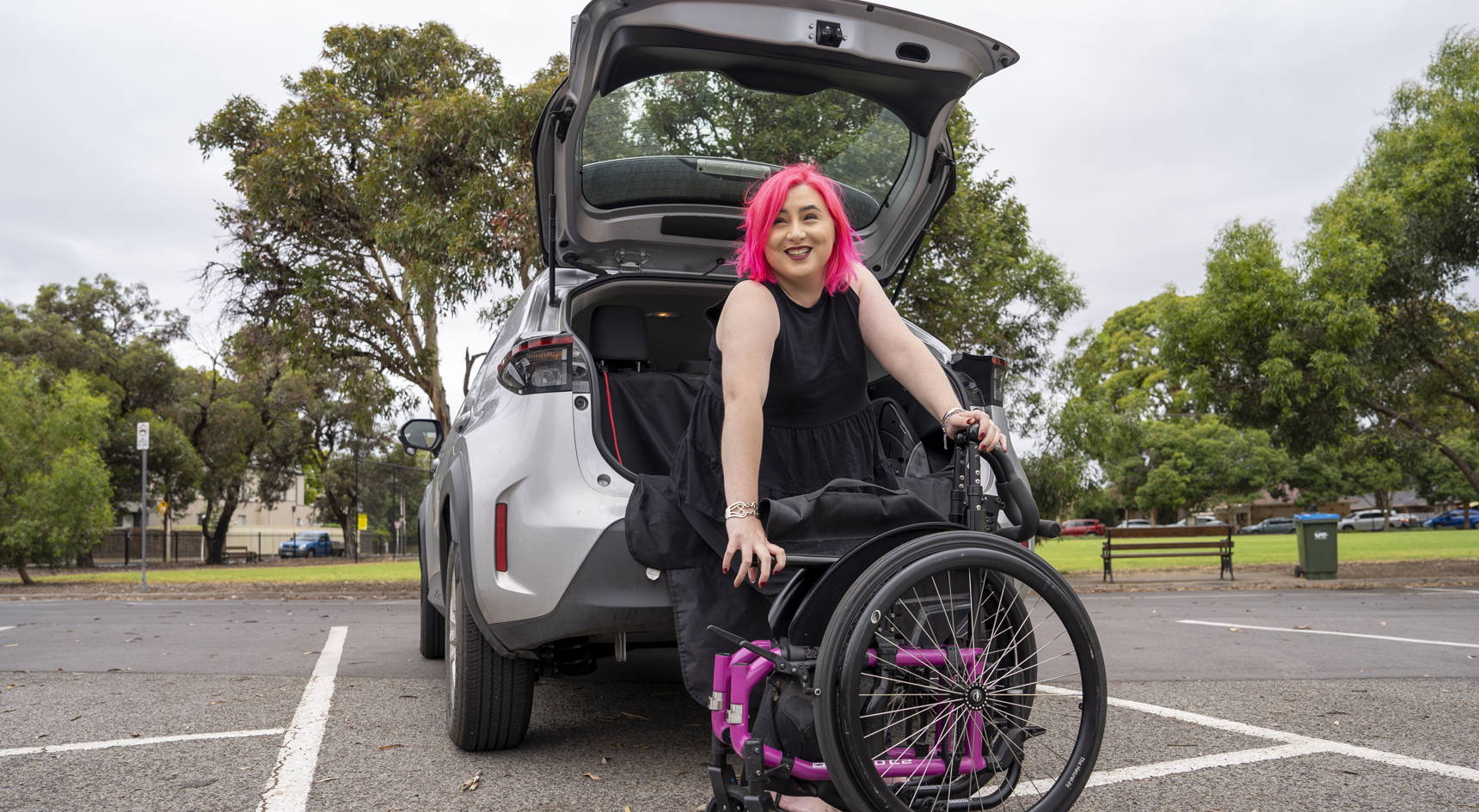 Bronwen Murphy packing her wheelchair in the boot of her car.