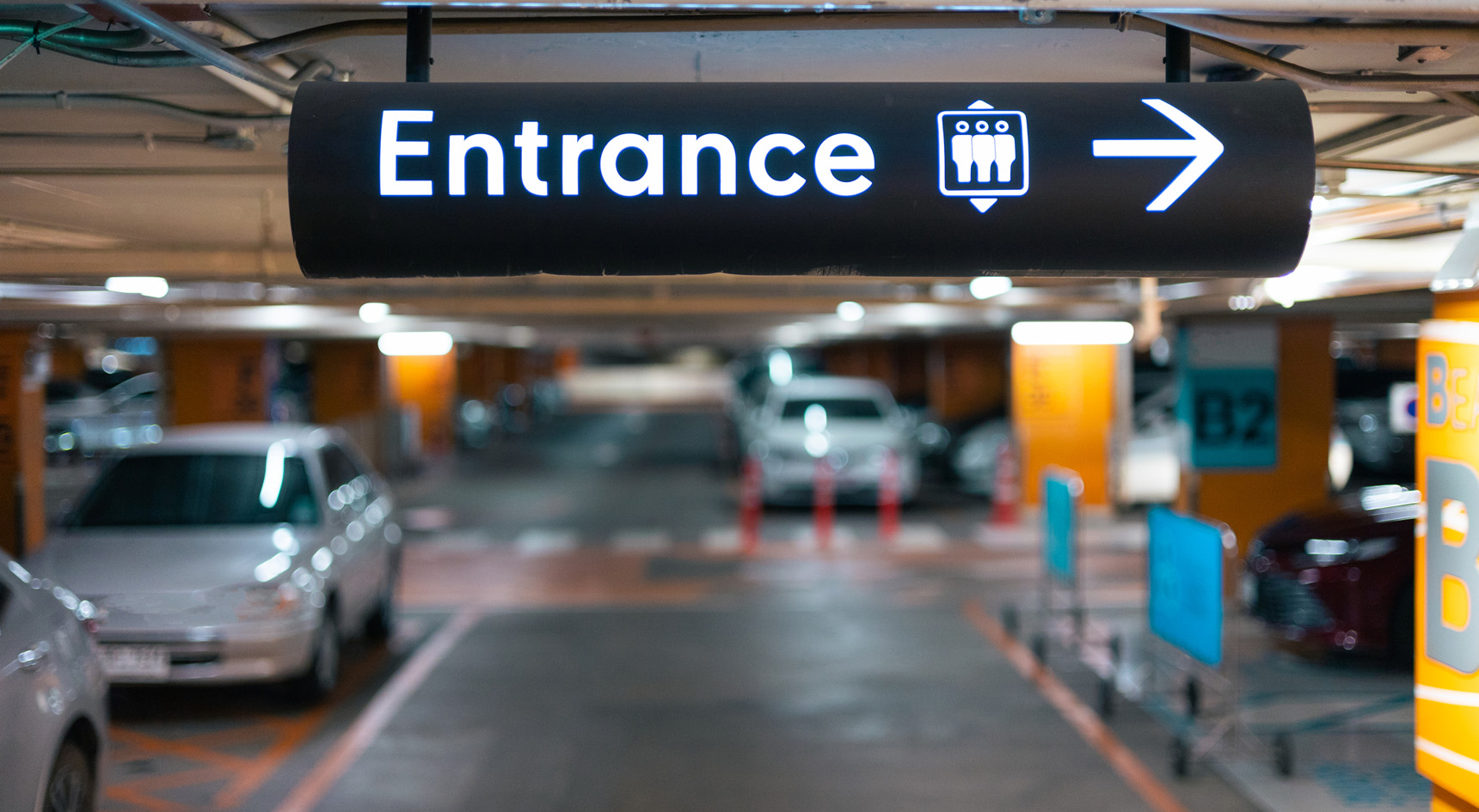 An image of an entrance sign at a car park.