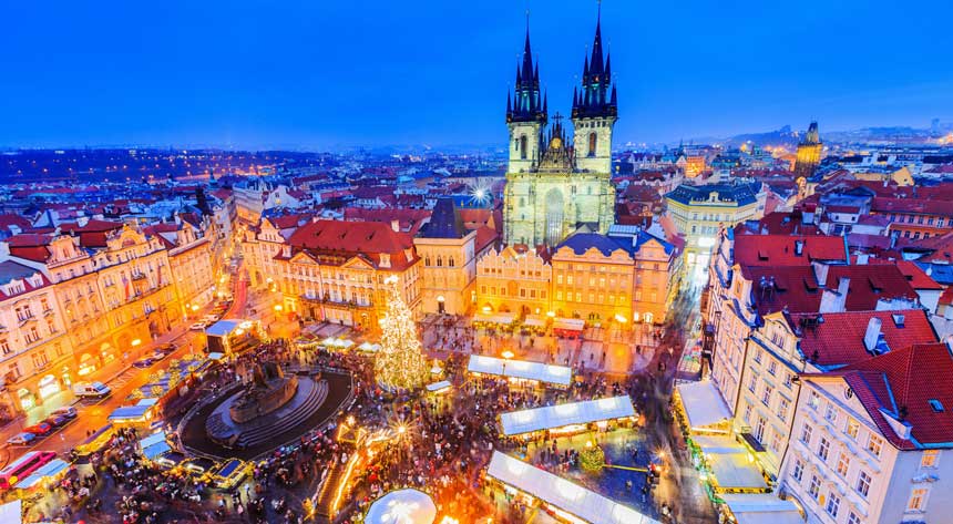 Prague Christmas markets with the cityscape in the background.