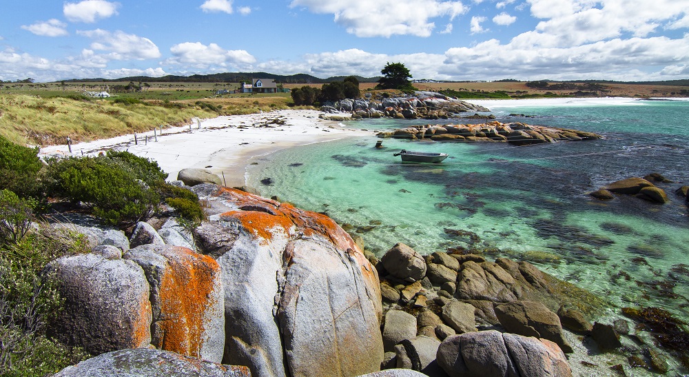 The orange rocks and clear waters of Bay of Fires.