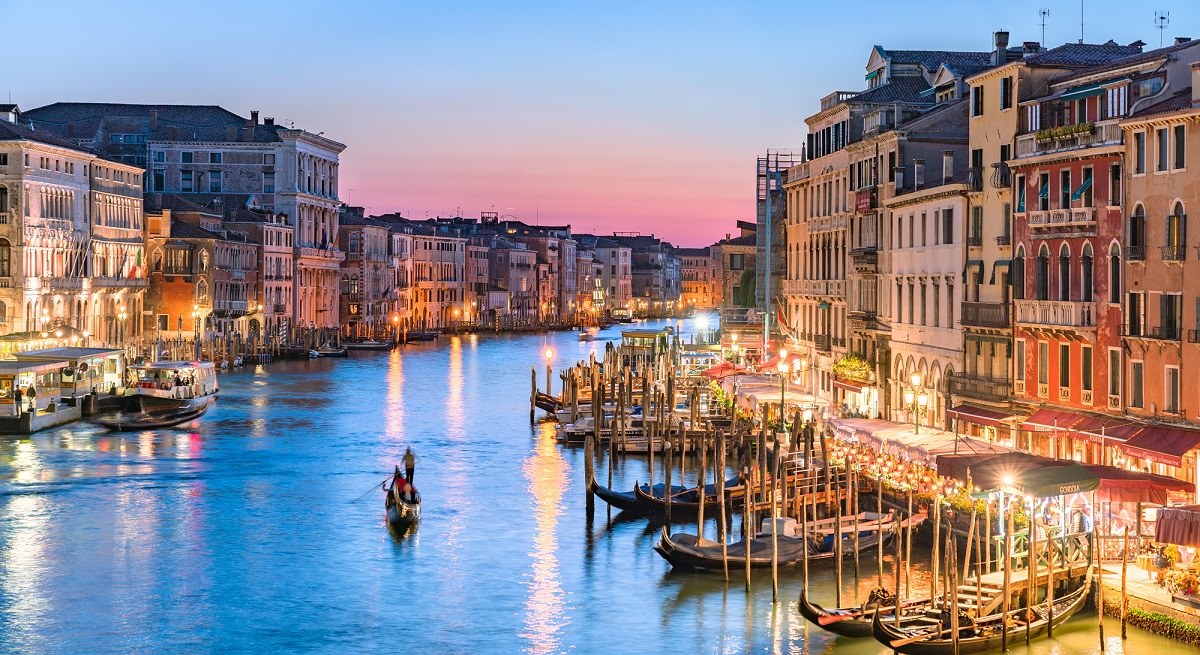 Twilight photo of a gondola on Venice's Main Canal.