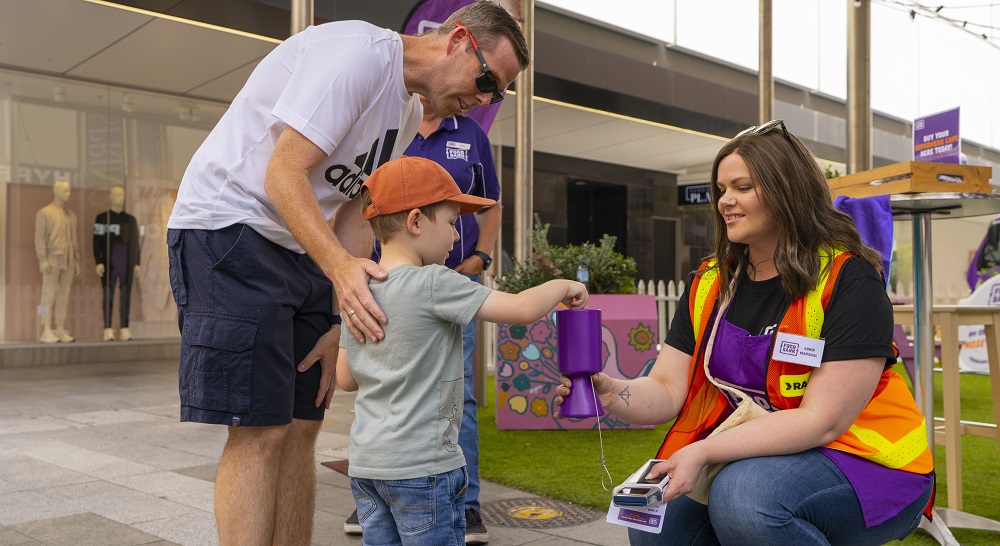 Child donating to Food Drive