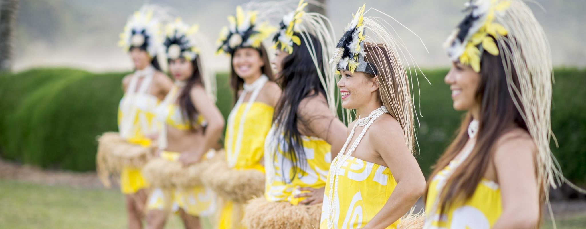 A group of women doing a traditional Hawaiian dance during a luau, Hawaii.